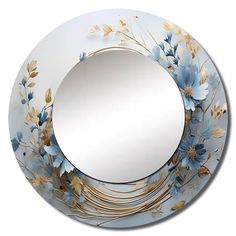 a round mirror with blue flowers and gold leaves on the rim is shown in front of a white background