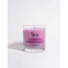 a pink candle sitting on top of a white table