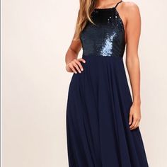 Feel Like The Princess You Were Born To Be In The Cotillion Matte Navy Blue Sequin Dress! Matte Sequins Cover A Princess-Seamed Bodice, With An Apron Neckline And Adjustable Spaghetti Straps That Crisscross At Back. Fitted Waist Tops A Cascading Chiffon Maxi Skirt. Fully Lined. Self: 100% Polyester. Lining: 100% Polyester. Dry Clean Only. Imported. Blue Sequin Beach Dress, Blue Sequined Beach Dress, Blue Contrast Sequin Dress For Summer, Blue Contrast Sequin Summer Dress, Blue Dresses With Contrast Sequin For Night Out, Backless Blue Maxi Dress For Cocktail, Blue Contrast Sequin Cocktail Dress, Blue Sleeveless Sequin Maxi Dress, Navy Maxi Dress For Summer Party