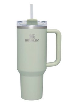 a white travel mug with a straw in the cup is shown on a white background