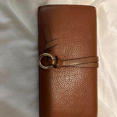 Condition: Very Good- Excellent Canvas: No Fading, No Cracks, Corners In Good Condition Interior: Great Condition With Very Minor Pen Mark Zipper: Runs Smoothly. Smell: No Unpleasant Smell What’s Included? Authenticity Card Please Manage Your Expectations. This Is A Pre-Loved Wallet Elegant Brown Wallet With Snap Closure, On-the-go Brown Crossbody Wallet, Luxury Brown Women's Wallet On Chain, Chic Brown Wallets With Gold-tone Hardware, Luxury Brown Women's Wallets, Chloe Bags, Brown Wallet, Chloe Bag, Wallets