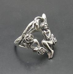 Sterling silver ring 925/1000, fairy and flower. Stamped 925. Approximate weight 8.5 grams. Top width 2.4cm. All our jewels are made from solid sterling silver 925/1000 and are carefully crafted by hand in our family workshop. We dispatch your orders in 5 working days, worldwide and the postage is $5. We ship registered priority mail. Please allow 5-7 working days for delivery in Europe and 10-15 working days outside Europe. For any questions - please do not hesitate to contact me! Sterling Silver Fairycore Jewelry, Fairy Style Sterling Silver Jewelry, Fairycore Sterling Silver Jewelry In Silver, Fairycore Sterling Silver Jewelry, Fairies Photos, Figural Jewelry, Flower Rose, Fairy Wings, Sterling Silver Ring