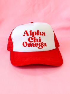 a red and white trucker hat with the words alpha chi omega on it