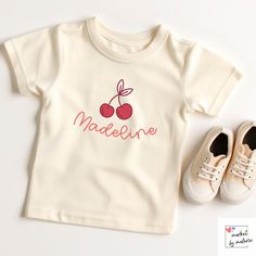 This custom name shirt is perfect for the little boy or girl in your life. Trendy, fun and simple, this shirt is the perfect custom gift.  Our unique and eye-catching shirts are crafted using the latest DTG (Direct-to-Garment) technology, ensuring high-quality prints that capture every detail of our designs. While we take immense care to maintain color accuracy in our products, it's important to remember that colors may appear slightly different on your computer monitor due to variations in display settings. The brightness, contrast, and color calibration of each screen can influence how our designs are perceived. Using the Bella + Canvas Shirts for printing CARE INSTRUCTIONS: Wash on cold, inside out, and tumble dry on low or hang dry. Do NOT iron design! // Ships in 2-3 business days // Cute Personalized Crew Neck T-shirt, Cute Cotton T-shirt With Name Print, Playful Organic Cotton T-shirt For Playtime, Cute Tops With Name Print For First Birthday, Cute Top With Name Print For First Birthday, Unisex Cute T-shirt For Playtime, Customizable Cute White T-shirt, Cute Crew Neck Shirt For First Birthday, Cute Short Sleeve Shirt For First Birthday