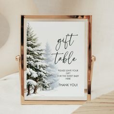 a christmas card with the words, gift table and thank you written in black ink