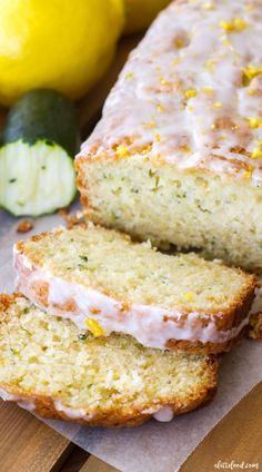 two slices of lemon zucchini bread sitting on top of a cutting board