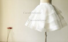 Custom Made(your own size, your preferred color, even your own design). Ivory Cupcake Tulle Skirt Three Tiered Horse Hair Tulle Skirt Other horse hair skirt for your reference, https://www.etsy.com/listing/211663905/black-tulle-skirthorse-hair-tulle?ref=listing-shop-header-1 Elastic waistband which is easy to fit different waist size. But also i can make it with satin waistband and zipper. High quality bridal tulle skirt with bridal satin lining. The listed skirt is mean to hit your knee but alw Elegant Fitted Mini Skirt For Wedding, Spring Wedding Fitted Mini Skirt, Spring Wedding Mini Skirt, Elegant Crinoline Petticoat For Party, White Tiered Petticoat For Wedding, Spring Wedding Ruffled Petticoat, White Full Skirt Petticoat For Party, Spring Wedding Petticoat With Ruffled Skirt, White Wedding Skirt With Attached Cancan