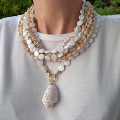 Cheap White Mother Of Pearl Necklaces, Elegant Long White Shell Necklace, Elegant White Long Shell Necklace, Bohemian Mother Of Pearl Necklace With Round Beads, Elegant Mother Of Pearl Necklace For Beach, Elegant Mother Of Pearl Beach Necklace, Handmade Multi-strand Mother Of Pearl Necklace, Handmade Beaded Necklaces With Mother Of Pearl, White Bohemian Jewelry With Mother Of Pearl