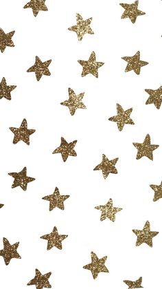 gold glitter stars on white background