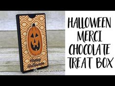 an orange and black halloween treat box with the words, halloween merci chocolate treat box