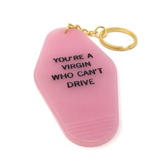 a pink plastic keychain with the words you're a virgin who can't drive