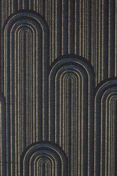 an art deco style wallpaper with black and gold stripes on it's surface