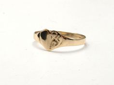 This is a fine, 9ct yellow gold signet ring with a heart face. The face measure just under 1cm across and has detail on one side. It's hallmarked as 9ct gold and weighs one gram. It's a size P now (US size 7,1/2) but I can size it up or down without further cost. It's finished as new and so would be suitable as a gift. Classic Heart-shaped 14k Gold Signet Ring, Classic Heart Shaped 14k Gold Signet Ring, Classic 14k Gold Heart-shaped Signet Ring, Classic 14k Gold Heart Engraved Ring, Classic Gold Heart Signet Ring, Gold Heart-shaped Signet Ring Stamped 14k, Classic 14k Heart-shaped Engraved Ring, Gold Signet Ring For Valentine's Day Stamped 14k, 14k Yellow Gold Signet Ring For Valentine's Day