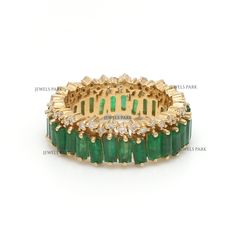 Emerald diamond baguette cut eternity band ring gold | Natural emerald zig zag design ring gold | Emerald diamond eternity band ring gold GEMSTONE DETAILS : ✦ Gemstone : Emerald ✦ Gemstone Type : Natural ✦ Gemstone Size : 4x2 mm ✦ Gemstone Shape : Bguette ✦ Number of Gemstones : 40 ✦ Gemstone Weight : 3-4 Carats ✦ Gemstone Grade : AAA DIAMOND DETAILS : ✦ Diamond Type : Natural ✦ Diamond Size : 1.20 MM ✦ Diamond Color : F-G ✦ Diamond Clarity : Slightly included ✦ Diamond Cut : EX-VG ✦ Diamond Weight : 0.30 Carats METAL DETAILS : ✦ Metal : 14K/18K Gold ✦ Metal Color : Yellow / White / Rose Gold ✦ Setting : Flush Setting ✦ Ring Box : Yes SHIPPING DETAILS : ✦ Production time : 10-12 days ✦ Delivery time : 7-8 days ✦ Expedited shipping : Available ✦ Expedited shipping service : UPS ✦ Expedited Baguette Eternity Band, Birthstone Engagement Rings, Diamond Ring Gold, Emerald Diamond Ring, Ringe Gold