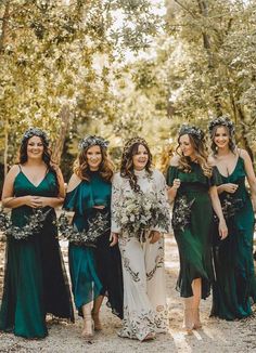 the bridesmaids are all dressed in green dresses and flower crowns for their wedding