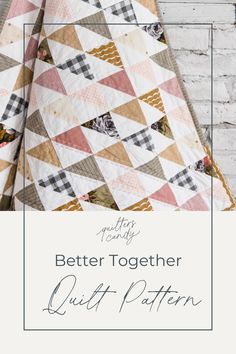 a quilt with the words, better together quilt pattern in white and pink on it