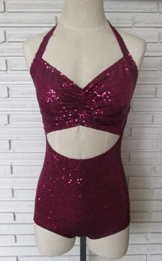 a mannequin wearing a red bikinisuit with sequins