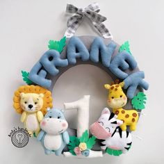 a wreath with stuffed animals and the number one on it