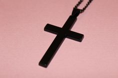 Introducing our Black Cross Pendant Necklace, a stylish and versatile accessory designed for both children and adults. This necklace features a sleek black cross pendant suspended from a black hip-hop long chain, creating a trendy and unisex piece suitable for various styles. Key Features: 1. Black Cross Pendant: The focal point of this necklace is the sleek black cross pendant, offering a modern and fashionable twist to the classic cross design. The pendant is crafted with attention to detail, Black Cross Necklace As Gift, Black Cross Pendant Necklace Gift, Minimalist Black Cross Pendant Necklace, Black Cross Pendant Necklace With Chain, Black Symbolic Cross Pendant Jewelry, Black Metal Cross Pendant Jewelry, Black Punk Cross Necklace, Black Nickel-free Cross Pendant Jewelry, Long Chain