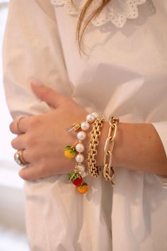 a close up of a person wearing bracelets