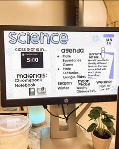 a computer screen displaying the science class starts in front of a potted houseplant