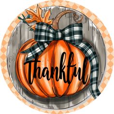 an orange pumpkin with a bow on it that says,'thank'in black and white