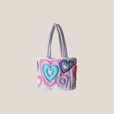 Hearts are all the rage and we love this unique and playful design.We're loving the vibrant colors, innovative designs, and luxe but sustainable materials that aligns with our contemporary fashion style. The trendy covergirl tote can fit all your daily accessories and necessities while keeping your outfit fresh and unique. Heart-shaped Summer Bag For Everyday Use, Trendy Multicolor Heart-shaped Bag, Multicolor Heart-shaped Bag For Daily Use, Heart-shaped Multicolor Bag For Daily Use, Trendy Shoulder Bag With Zipper For Valentine's Day, Trendy Shoulder Bag For Valentine's Day Shopping, Trendy Valentine's Day Shoulder Bag With Zipper, Valentine's Day Trendy Shoulder Bag With Zipper, Trendy Heart-shaped Bag With Removable Pouch