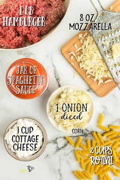 the ingredients to make an italian meatball recipe laid out on a marble counter top