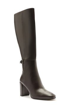 Designed to complement any style and occasion, this napa-leather boot is handcrafted with a tall block heel and decorative buckle strap. 2 3/4" (70mm) heel Side zip closure Leather upper, lining and sole Made in Brazil Designer Shoes Luxury Heeled Boots With Buckle For Fall, Luxury Heeled Boots With Buckle Closure For Fall, Formal Boots With Stacked Heel And High Shaft, Formal High Shaft Boots With Stacked Heel, Formal Boots With Block Heel, Formal Block Heel Boots, Block Heel Boots With Buckle Closure In Medium Width, Wide Calf Leather Heeled Boots With Buckle Closure, Leather Wide Calf Heeled Boots With Buckle Closure