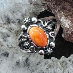 Beautiful Carolyn Pollack Sterling Silver Oval Orange Spiny Oyster Cabochon Decorated Split Shank Ring For Women. Size 6, 8, 10 Length 5/8" Weighs Approx 4.3 Grams ** Stones Are Natural, Therefore Matrix And Color Shades May Vary. ** ** If Oxidation Or Tarnish Darkens The Piece Over Time, Use A Polishing Cloth To Restore To Desired Finish. ** (Cprn83e92) Formal Orange Sterling Silver Rings, Hypoallergenic Orange Sterling Silver Jewelry, Orange Sterling Silver Ring, Orange Sterling Silver Ring With Polished Finish, Sterling Silver Orange Gemstone Rings, Split Shank Ring, Spiny Oyster, Split Shank, Ring For Women