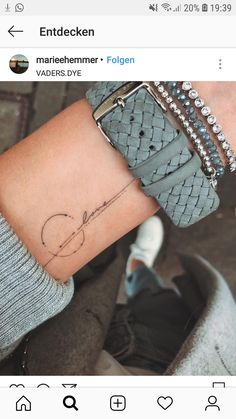 a person with a tattoo on their wrist