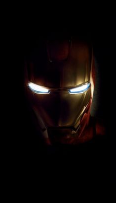 iron man in the dark with glowing eyes