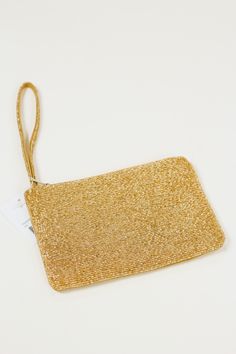 Make waves with this gold beaded wristlet! Rock 'n roll right-on to your next event with this eye-catching accessory that'll have you standing out in any crowd. It's sure to be a conversation starter and keep you looking sharp. (So, go ahead and show 'em who's boss!) Gold Beaded Bracelets For Evening, Elegant Gold Wristlet For Evening, Party Wristlet With Wrist Strap, Trendy Gold Beaded Bracelets For Party, Gold Wristlet For Parties, Gold Adjustable Wristlet For Party, Adjustable Wrist Strap Wristlet For Party, Adjustable Wristlet With Wrist Strap For Party, Adjustable Gold Wristlet For Party