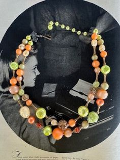 "50s 2-Strand Citrus with Variety of Beads Necklace. Very unique and beautiful with the variety of beads used.  Moon Glow round beads in Orange, taupy apricot, and  green, gold metal filagree beads, crackle lemon chiffon and crackle green irregular shaped beads , red-orange glass faceted round beads with gold filagree bead caps, dimpled pitted green irregular Lucite beads and in a couple different sizes. There are gold textured ornate bone shaped bead spacers. The maximum length is 20\" which includes the green pearlized extension chain. The shortest length is 17\" .It has pewter tone metal connectors on either side and a hook and extension chain on either end.  This in one of the most unique beaded pieces I seen with the interesting combo of beads and hardware. Love it! Free Shipping in t Vintage Multi-strand Beaded Necklace With Colorful Beads, Vintage Multi-strand Beaded Necklaces With Colorful Beads, Vintage Multi-strand Colorful Beaded Necklaces, Retro Round Bead Jewelry For Parties, Retro Round Beads Jewelry For Party, Retro Beaded Jewelry For Party, Retro Beaded Party Jewelry, Vintage Multi-strand Beaded Necklace, Vintage Beaded Necklaces With Colorful Beads