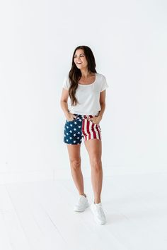 Features High rise Frayed hem Zipper fly Flag print: blue with white stars; red and white stripes 93% Cotton, 6% Polyester, 1% Spandex Size + Fit Kristin is 5'4", a size 1 and is wearing a Small Ashley is 5'6", a size 18 and is wearing a 1X Small 2-4, Medium 6-8, Large 10-12, X-Large 14-16, 1X 16-18, 2X 18-20, 3X 20-22 True to size. Do have stretch, but do not lose shape. Waist measurements are taken while laying flat and doubled. Curvy sizes have more room in the waist Click here for white top Patriotic Bottoms With Flag Print For 4th Of July, Patriotic Flag Print Bottoms For 4th Of July, Red Flag Print Bottoms For 4th Of July, Patriotic Fitted Bottoms For 4th Of July, Patriotic American Flag Bottoms For 4th Of July, Casual High Waist Bottoms With American Flag Print, Cotton Shorts With Star Print, Casual High-waist Bottoms With American Flag Print, White Summer Bottoms With Star Print