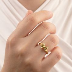 14k Gold Ribbon Ring | Genuine Solid Gold Ring | Ribbon Shape Gift For Her ➤ Ring Details * 14k / 18k Yellow Gold or Yellow Sterling Silver * Gold Color Options; 14K / 18k White, Yellow, Rose Gold * Sterling Silver Color Options; Yellow, Rose, White * Top Width: 9 mm * Top Length: 9 mm * Band Width: 1.90 mm * Band Thickness: 1.45 mm * Ready to Ship 3-5 Business Days 💍 ISEA Jewels' pieces are handcrafted by 10-15 years of experienced craftsmen and made to order in a very short time. 🎁 All pieces come in a quality and hygienic suede gift box enclosed in a pouch. 🌎 Our products arrive worldwide within 6 working days. ❓ Questions, comments, or just want to say hi? We are glad to hear from our customers and are always quick to respond. Reviews are always appreciated ✨ 💫 Find out more about Bow Gold Ring, Gold 14k Birthstone Ring As Gift, Yellow Gold Flower Ring With Birthstone For Gift, 14k White Gold Flower Ring Gift, Fine Jewelry Yellow Gold Rings For Gift, Dainty Yellow Gold Ring For Gift, Dainty Yellow Gold Rings Perfect For Gifts, 14k Gold Open Flower Ring For Anniversary, Dainty Yellow Gold Rings For Gifts