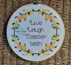 a cross stitch pattern with the words live laugh taster bath on it's hoop