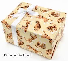 a wrapped gift box with a tiger pattern on it