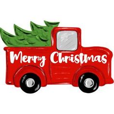 a red truck with a christmas tree in the back and merry christmas written on it