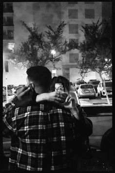 black and white photograph of two people embracing each other