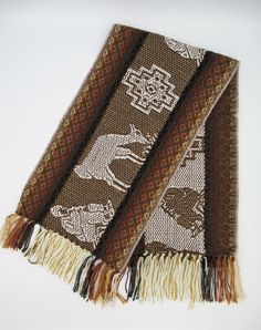 This beautiful Alpaca wool scarf is woven from Alpaca wool blend with llama and chakanas design. This scarf is originally made from local makers in Cusco - Peru. This beautiful scarf is a perfect cozy gift for your love one. Features: * Made from Alpaca and acrylic yarn. Measurements: 62 inches (L) x 9.5 inches (W) Dry clean or hand wash gently in cold water with mild detergent - dry flat - no machine dryer Brown Traditional Patterned Scarves, Bohemian Alpaca Scarves For Winter, Traditional Woven Winter Shawl, Traditional Brown Shawl With Woven Motifs, One Size Handwoven Alpaca Shawl, Brown Alpaca Shawl, Brown Handwoven Winter Scarves, Bohemian Brown Handwoven Scarves, Bohemian Brown Handwoven Scarf