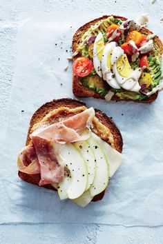 two slices of bread with meat and vegetables on them