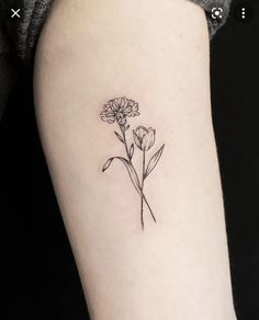 a single flower tattoo on the left arm