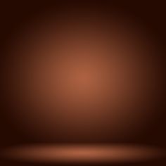 a dark brown background with some light coming from the top and one corner to the bottom