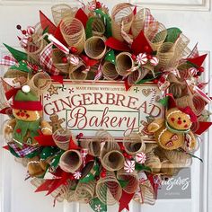 a wreath made out of burlocks and christmas decorations with gingerbread bakery written on it