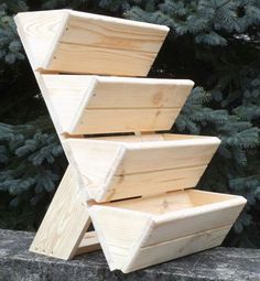 three wooden boxes stacked on top of each other