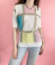 Vintage 80s 90s Beige White Multicolor Pastel Color Block Short Sleeve Knit Sweater Blouse FREE SHIPPING Pullover closure, material has a textured lookGreat conditionBrand - Shapely KnitsTag size - noneSeen on size small - (check measurements for best fit) Measurements (laying flat)Chest - 21 inLength - 24 in#80sblouse #colorblockshirt #pastelblouse #knitblouse #80sabstractblouse*i try to include all noted flaws, but vintage is expected to have some wear from age and use (please ask all question Retro Knit Color Block Tops, Retro Color Block Knit Tops, Vintage Multicolor Color Block Sweater, Pastel Blouse, Short Sleeve Knit Sweater, Color Block Shirts, Flat Chest, Sweater Blouse, Pastel Colors