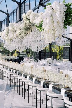 Elegant all-white wedding reception with stunning floral chandeliers and luxurious decor. Garden Wedding Tent, Reception Decorations Wedding, Event Venue Design, Decorations Wedding Reception, Tent Wedding Reception, Elegant Wedding Decor, Elegant Wedding Themes, White Weddings Reception, Wedding Reception Decor