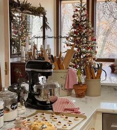 a kitchen counter topped with cookies and christmas trees