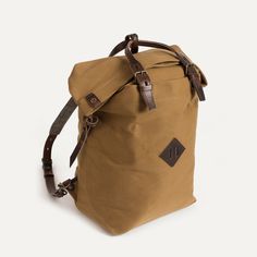 Canvas and Leather Backpack - Outdoor Inspiration | Bleu de chauffe Brown Backpack With Leather Handles For Outdoor, Functional Brown Backpack With Adjustable Straps, Beige Satchel Backpack For Outdoor, Brown Leather Trim Backpack For Outdoor, Casual Beige Backpack With Leather Handles, Casual Backpack With Leather Handles For Adventure, Casual Outdoor Backpack With Leather Handles, Brown Satchel Backpack With Adjustable Straps, Brown Outdoor Backpack With Leather Handles